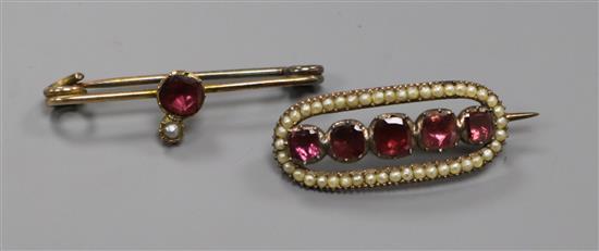 Two Victorian yellow metal, garnet and seed pearl set brooches. largest 39mm.